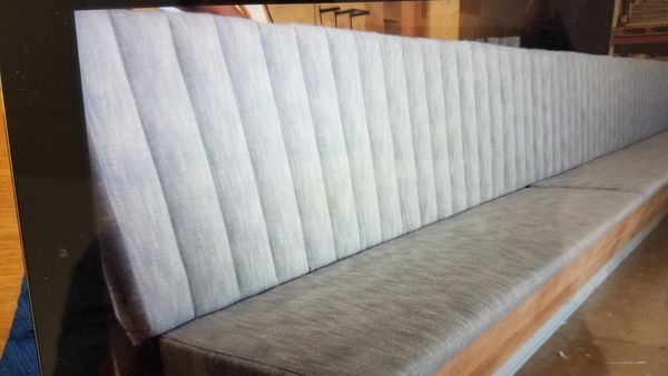 Long bench for restaurant booth, ready for use in elegant Florida home