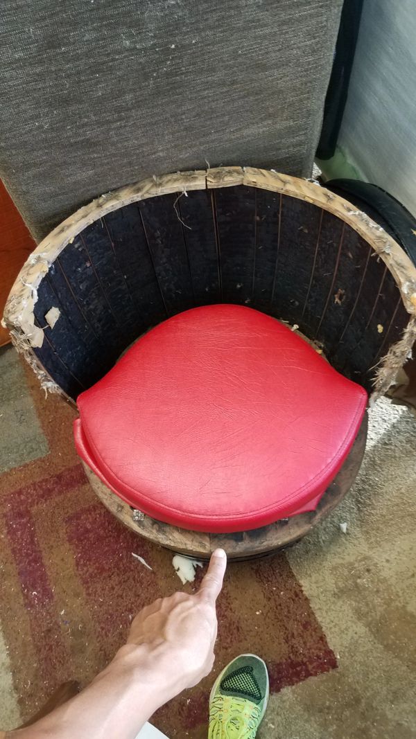 stripped of upholstery before placing black padding and vinyl covers