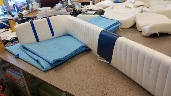 boat cushioned corner backrest for passengers.
