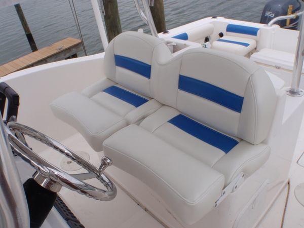 Blue and white boat captain seating and passenger seating. marine upholstery done right