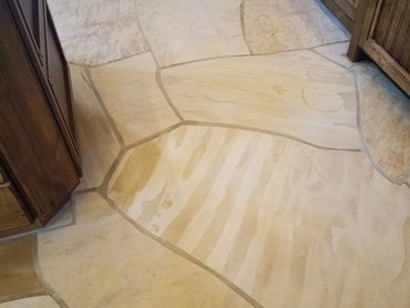 Natural stone flooring in residential kitchen