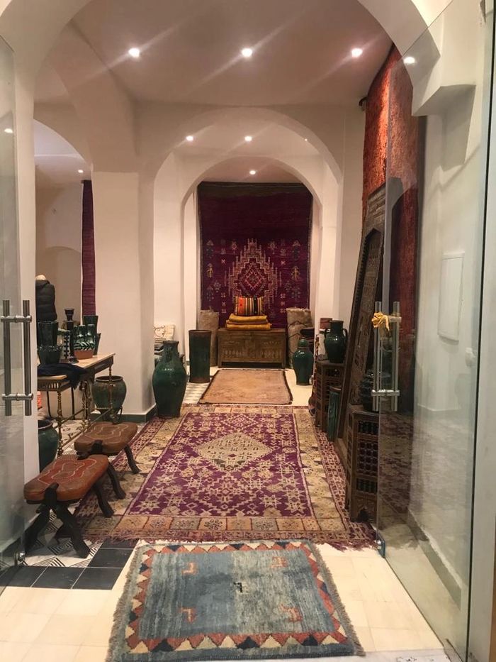 Interior of Moroccan Creations, Tangier, Morocco rugs pottery and doors