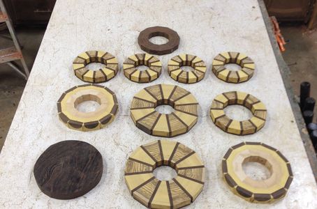 I use a process called "Segmented Wood Turning" I glue small pieces of wood into rings or Blocks. 