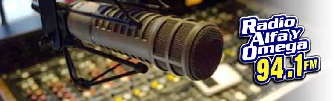 Close-up of a microphone in a radio studio with Radio Alfay Omega 94.1 FM logo.