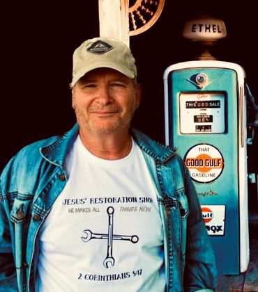 White tee with black letters.