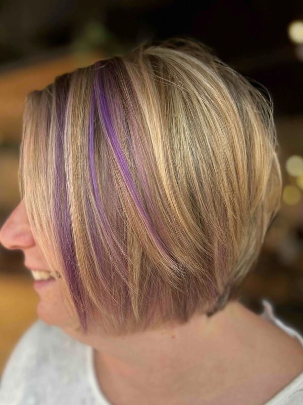 Pop of purple always adds some fun to this highlighted layered bob by Meredith