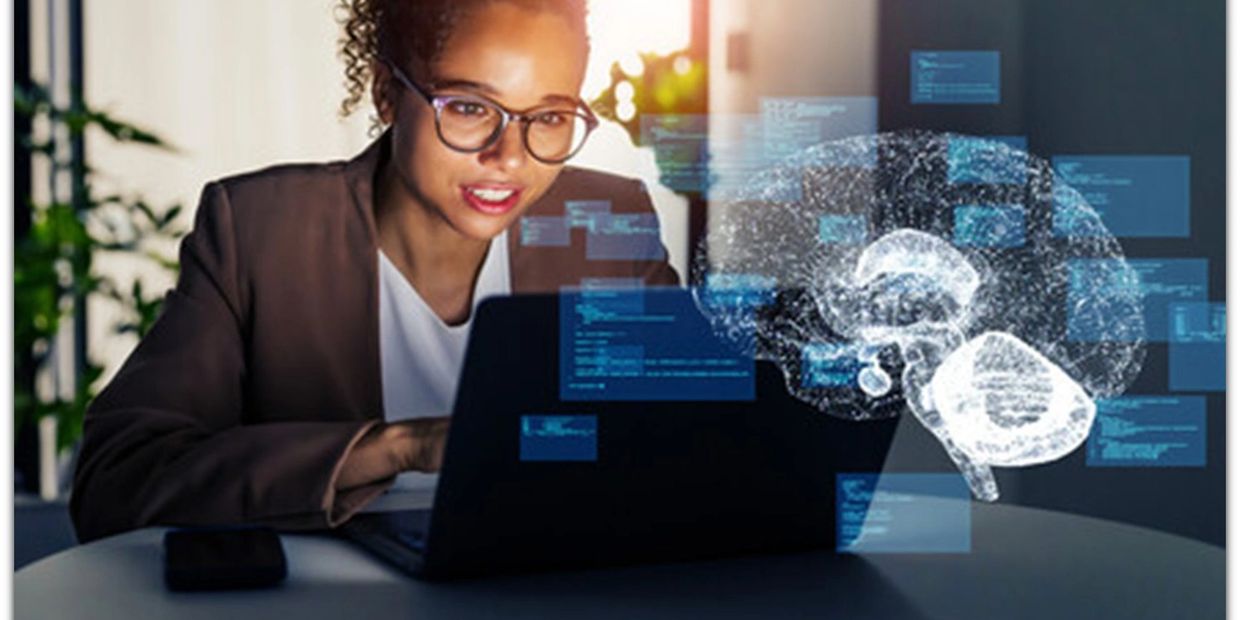 Woman working on laptop with digital brain hologram and data overlays.