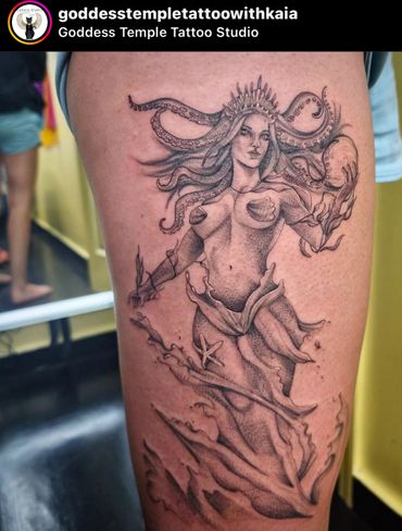 very detailed fine line black and grey tattoo of a Siren