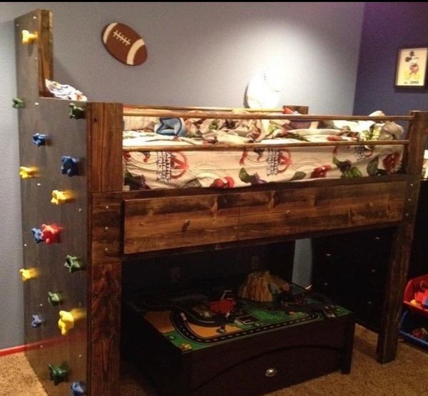Loft bed with rock climbing wall on the side