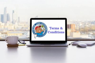 Computer on a desk looking out a window at a City with Terms and Conditions on the screen.