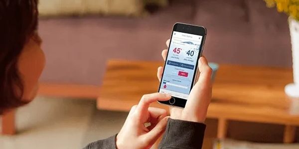 The EcoWater Hydrolink app being used by 
a woman to monitor your home water quality