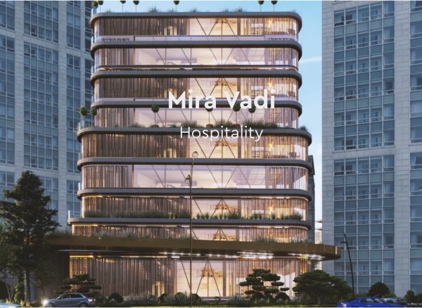 Modern Mira Vadi Hospitality building with sleek glass and rounded edges.