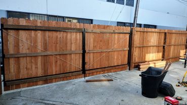 RED STANWOOD VERTICAL WOOD FENCE.