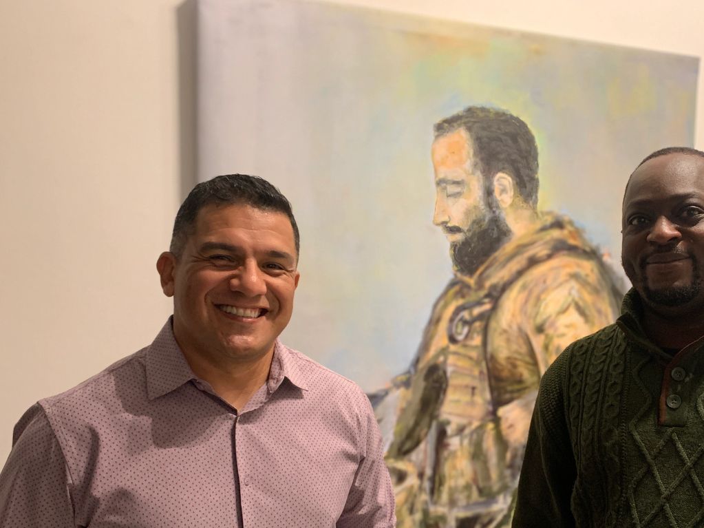 Mickey Chavez with Marine Brother who served together with artwork honoring "Abu".
