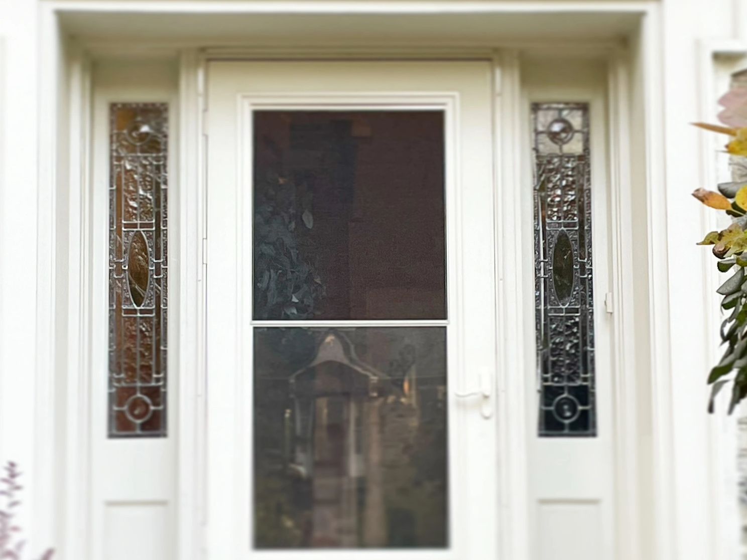 Front door sidelights with new leaded glass custom design installed.