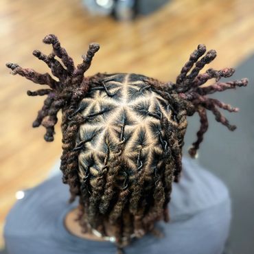 Locs styled into ropes and spiky buns.