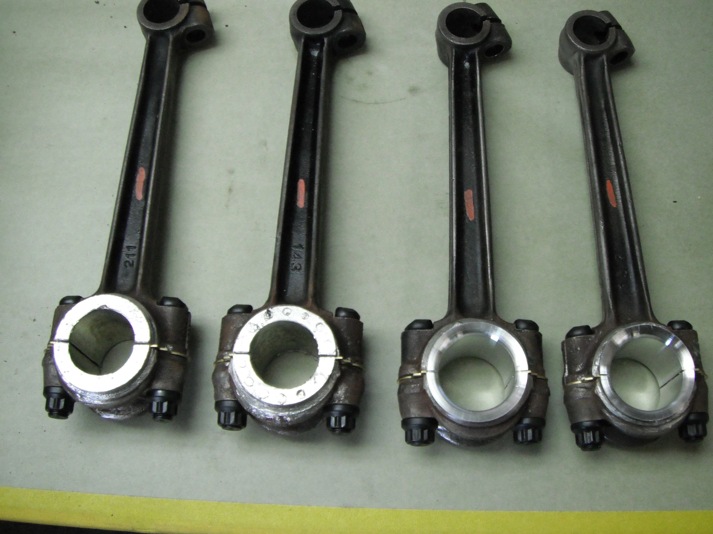 Model T Ford Engine Connecting Rods with 4X Nickle Babbitt in various stages of finish.