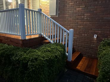 Front verandah with white timber balustrade and decking by Pixi Builds Melbourne