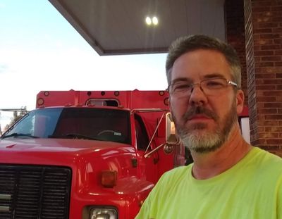 Greg Rose with chipper truck (tree service)
