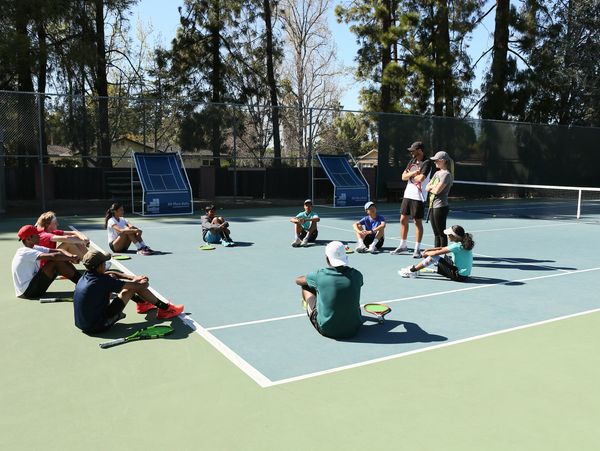 Brookside Tennis Training talking with our tennis academy competition team