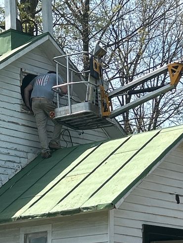 Johnsontown Church electrical repairs on steeple.