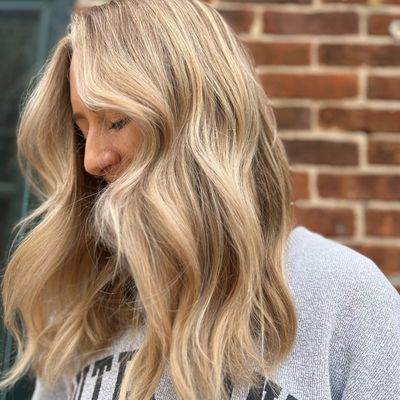Woman with long, wavy blonde hair.