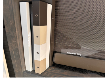Close-up of aluminum profiles and reinforced fabric welding on a mesh screen door.