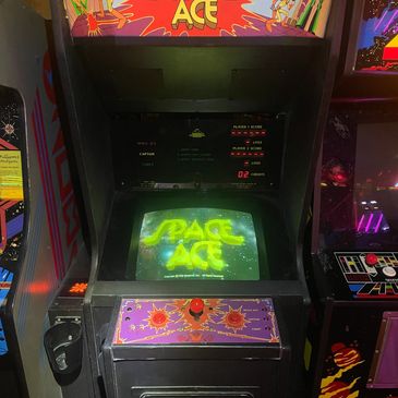 Classic Space Ace arcade game machine with colorful controls and screen.