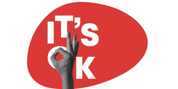 A hand doing the 'ok' symbol on an deep red background