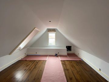 Historic Charleston attic repaint with fresh white walls, ceilings, and trim by LG Painting + Constr