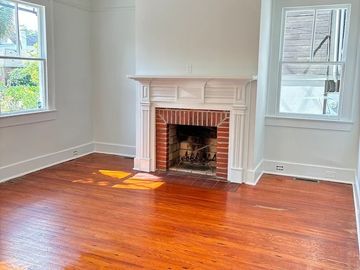 Interior repaint completed in Historic Charleston. Fresh walls, trim, and fireplace by LG Painting +