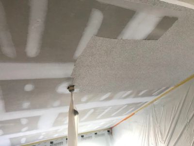 Professional popcorn ceiling removal project in Charleston, SC. Existing ceiling texture was removed