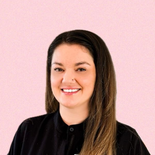 Smiling woman with long hair.