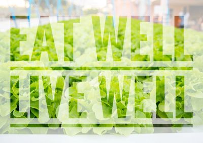Fresh green lettuce with the words 'EAT WELL LIVE WELL' overlayed.