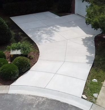 New concrete sidewalk and driveway installed by The A-Team Asphalt & Concrete in Southwest Ohio