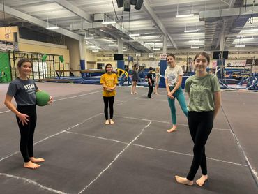 four girls are playing at the Gymnastic club