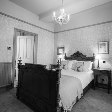 Cozy bedroom with vintage wooden bed and soft lighting.