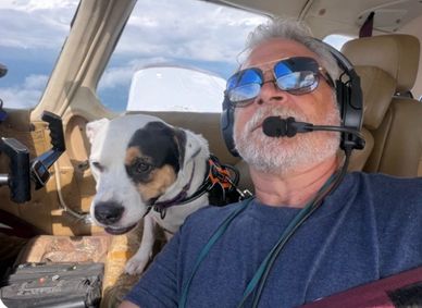 Rascal flying home with Capt. Greg of Pilots n Paws