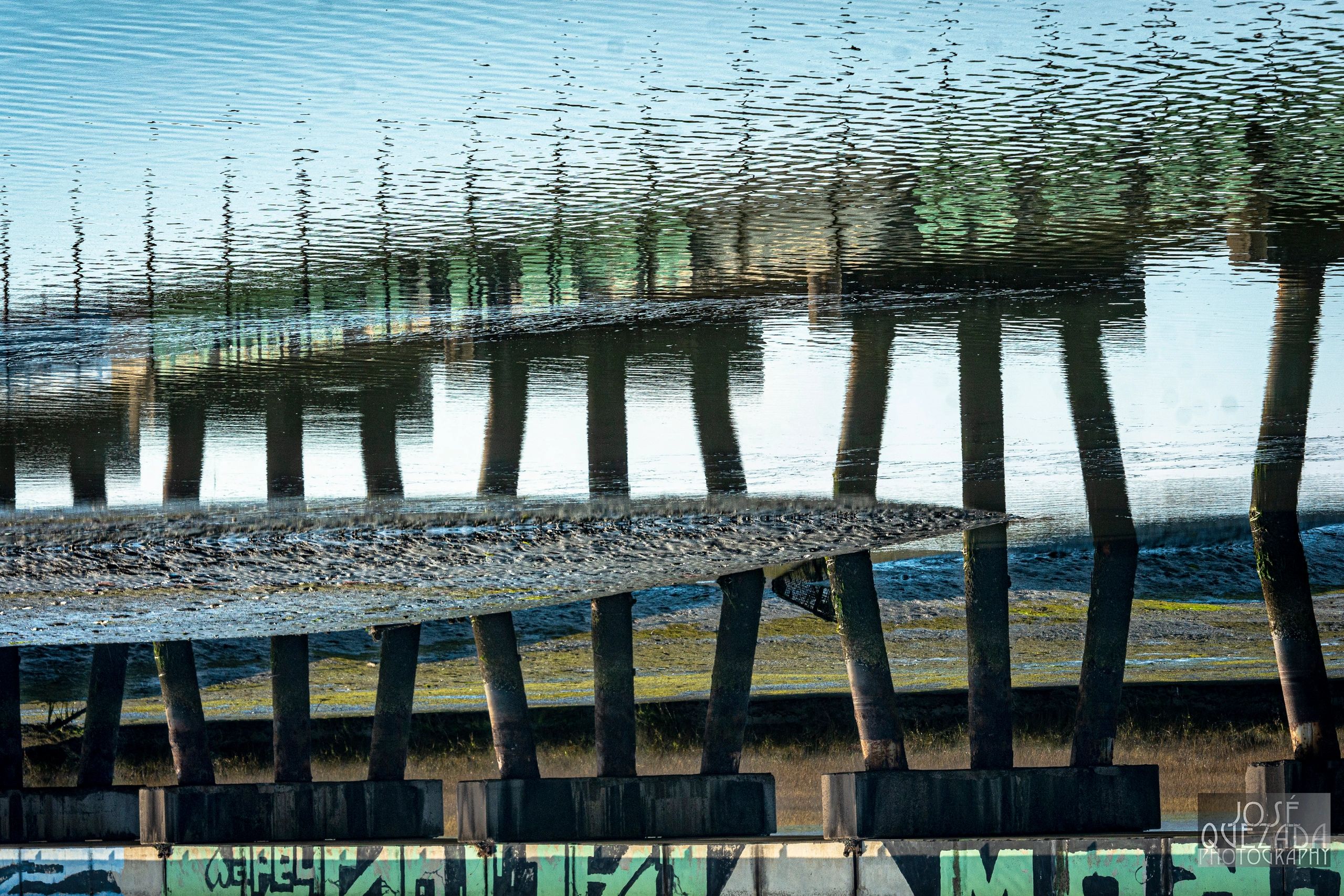 Reflection off of Eureka Slough of train trestle pilings.