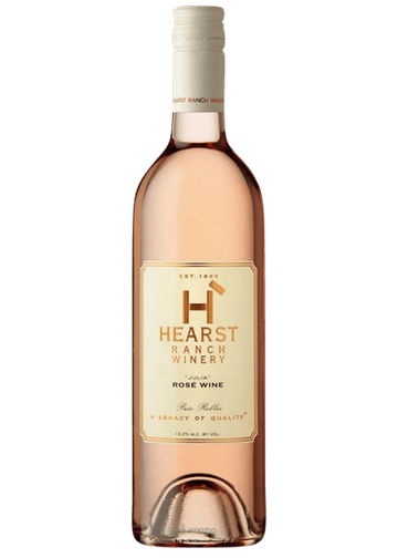 A bottle of Hearst Ranch Winery Julia Rosé Wine with a white cap.
