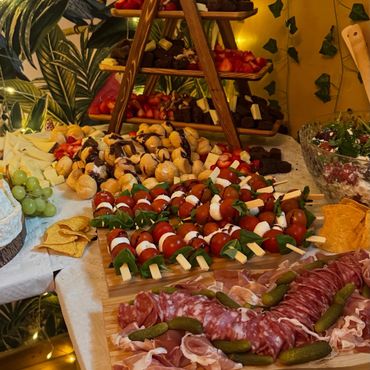 Caprese skewers, salami selection and sweet stack