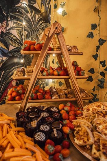 sweet stack of brownies and strawberries and mini cakes