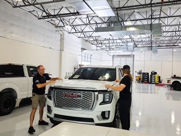 Install of paint protection film on the hood on a GMC Yukon denali