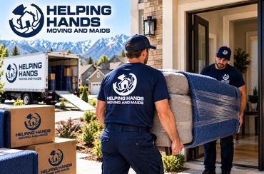 Helping Hands Moving and Maids movers carrying a wrapped sofa into a Utah home during a residential