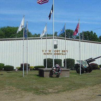 Front view of the VFW Post 9871 North Ridgeville building with flags flying