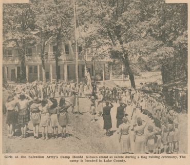 "Girls at the Salvation Army's Camp Houdd Gibson stand at salute during a flag raising ceremony.