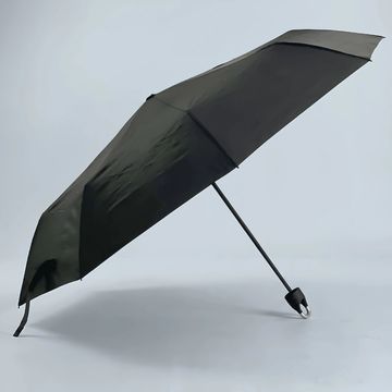 Paraguas negro abierto.