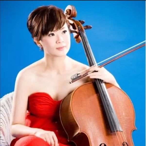 Ms. Jocelyn Wei (Wei, Yi-Ying) in a red dress, holding a violin in her hand