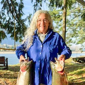 Cassandra with two very large Kamaloop Trout caught near Clark Fork Delta Lake Pend Oreille 