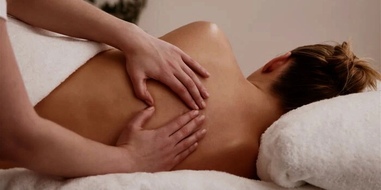 Side-lying prenatal massage for back relief at Honey In Hand Spa in Bigfork, Montana